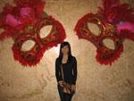 Sonya next to some very large masquarade masks